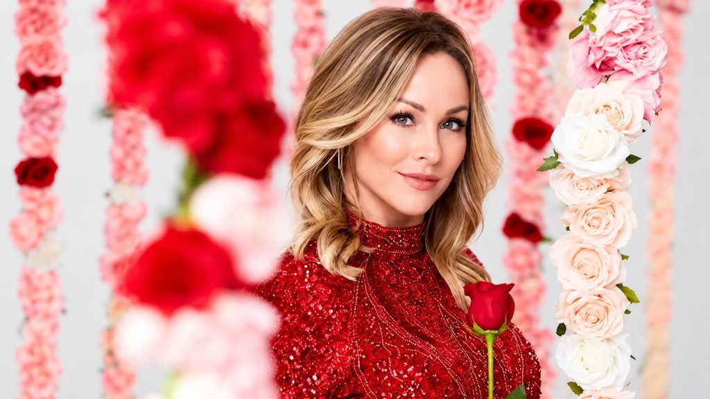 Clare Crawley wearing a red sequined dress and holding a red rose