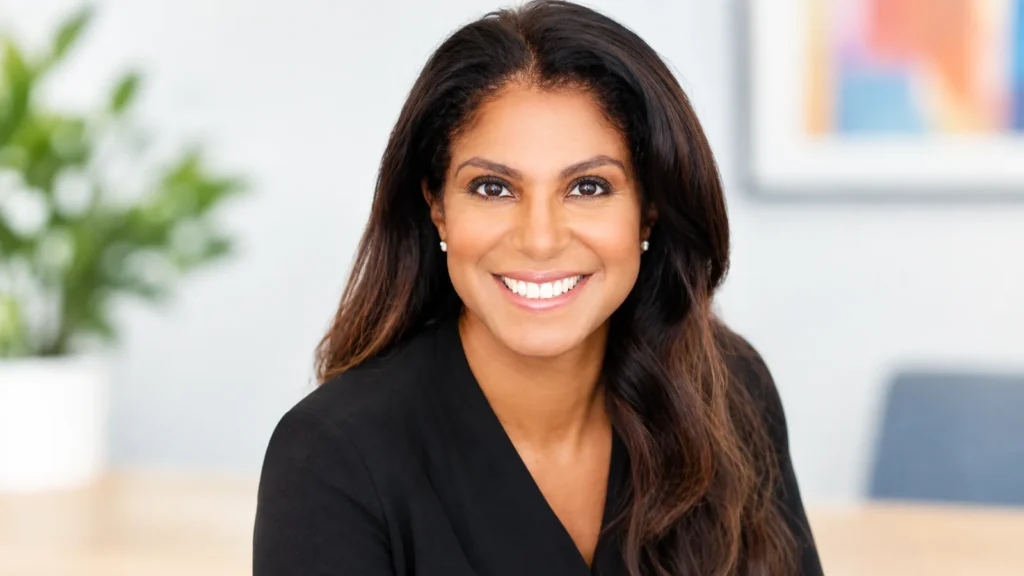 Andrea Adair DuBois smiling in a professional headshot wearing a black top