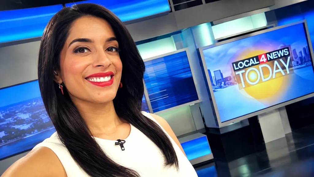 Priya Mann smiling in a TV news studio