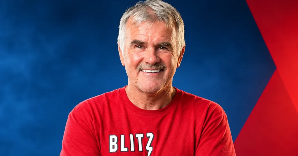 Roll Tide Willie smiling in a red BLITZ shirt