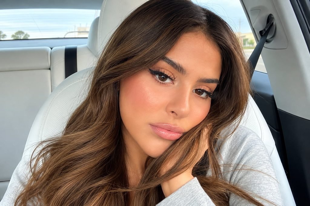 Lauren Giraldo posing for a photo with long brown hair and natural makeup