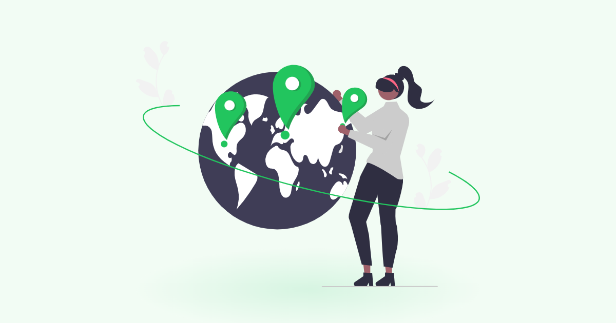 FSPSX vs FTIHX: woman pointing at global map pins on a globe to compare international funds